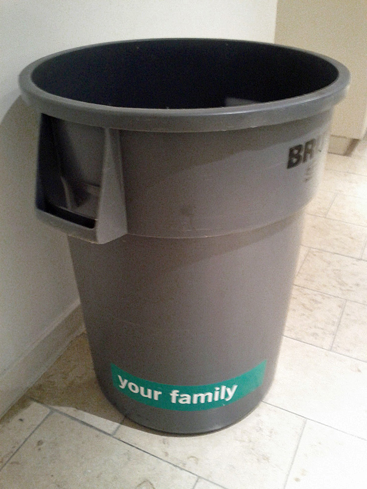 Picture of a grey bin with a sticker 'your family' on it